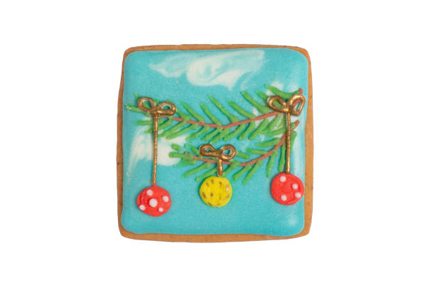 Homemade gingerbread cookie „Christmas tree branch with ornaments“ on white, isolated Christmas handmade gingerbread cookie „Christmas tree branch with ornaments“ on white background, top view, flat lay
