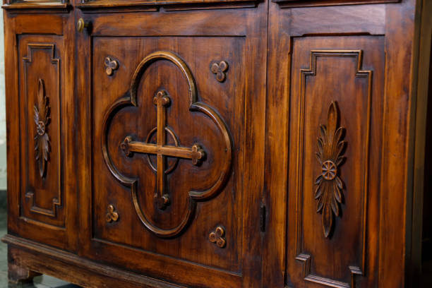 istock wooden confessional inside a church 2185371345
