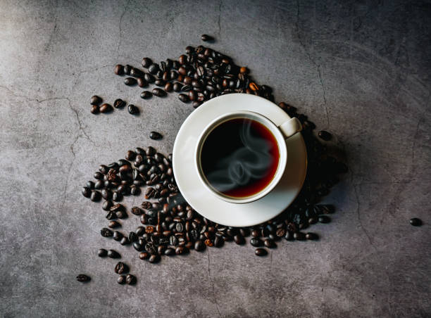 istock Coffee cup and coffee beans on gray background, Black coffee cup aromatic, top view 2185372950