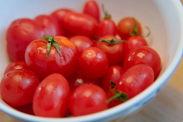 Fresh Juicy Tomatoes in a White Bowl