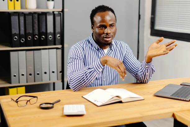 istock Professional man working on laptop at desk 2185373860