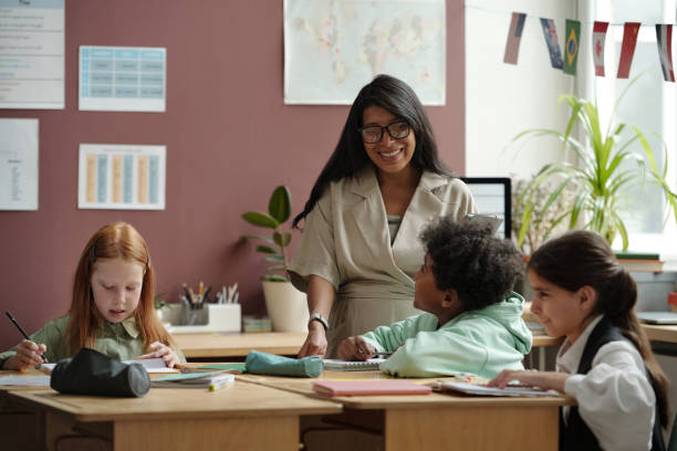 istock Teacher in front of several schoolkids 2185374058