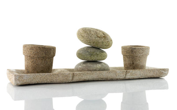 istock plate with stones  in balance 2185374622