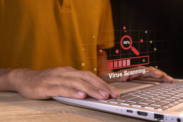 istock Man working on laptop with virtual screen of virus scanning process. Anti virus and bug protection technology concept. 2185375300