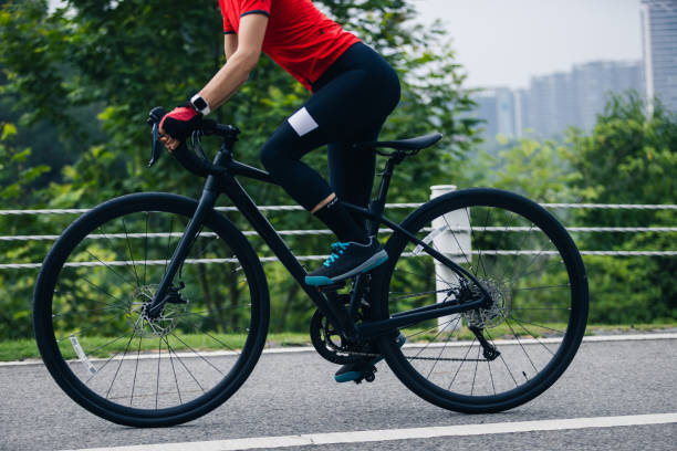 istock Asian woman cycling on summer trail 2185377721