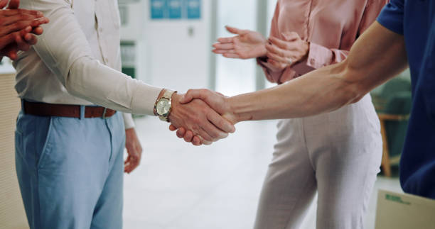 istock Group, doctor or team with applause for handshake, meeting or congratulations together at hospital. Closeup, people or medical employees shaking hands and clapping for winning, hiring or promotion 2185377969