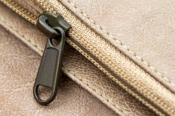 Close-up of the zipper on a leather wallet. Leather with metal zipper