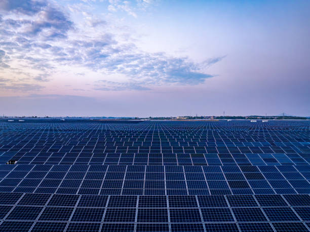istock Solar photovoltaic panels array aerial photography at sunset 2185381950