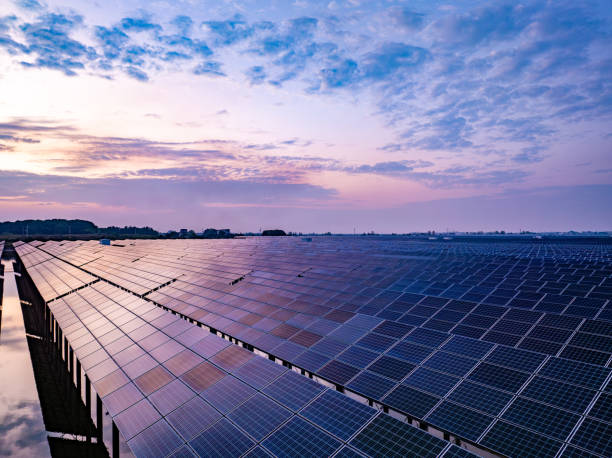istock Solar photovoltaic panels array aerial photography at sunset 2185381997