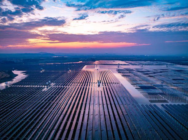 istock Solar photovoltaic panels array aerial photography at sunset 2185382068