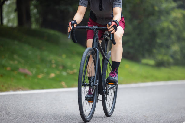 istock Asian woman cycling on summer trail 2185383665