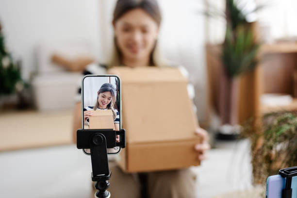 istock Unboxing Vibes: Asian Influencer Gears Up to Share the Joy 2185387127