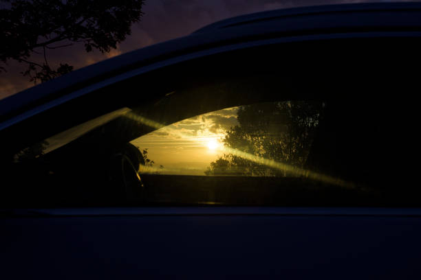 istock Sunset sun with glare through car window horizontally 2185389642