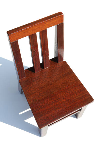 Small mahogany chair on a white background