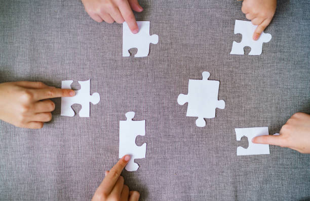 istock A group of children put puzzle pieces together 2185391296