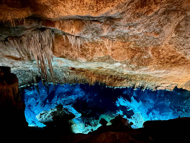 istock Artistic view in a cave with a lake 2185391899