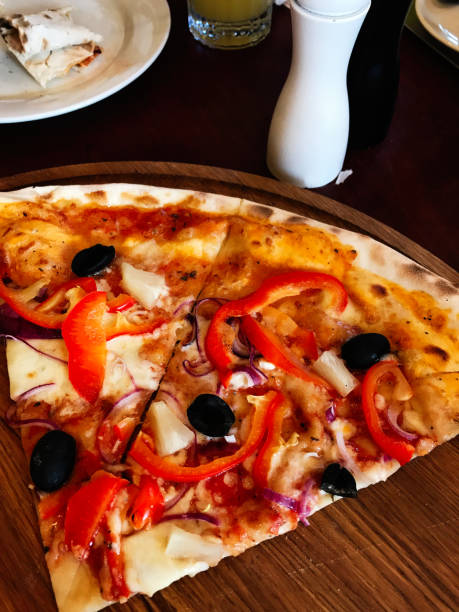 istock Delicious vegetable pizza slice with olives and bell peppers 2185393061