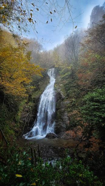 istock A waterfall in the valley in autumn 2185395264