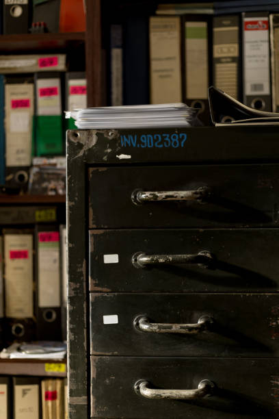 istock Vintage Filing Cabinet and Archive Shelf in Soft Light 2185395556