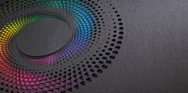 istock Colorful Gradient Paper Cutout Art with Circular Perforated Design on Dark Gray Background 2185398987