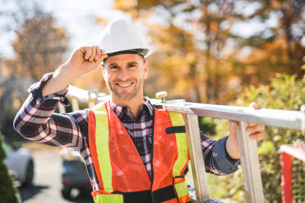 istock inspector or engineer with ladder checking the building structure and house roof specifications. 2185401392