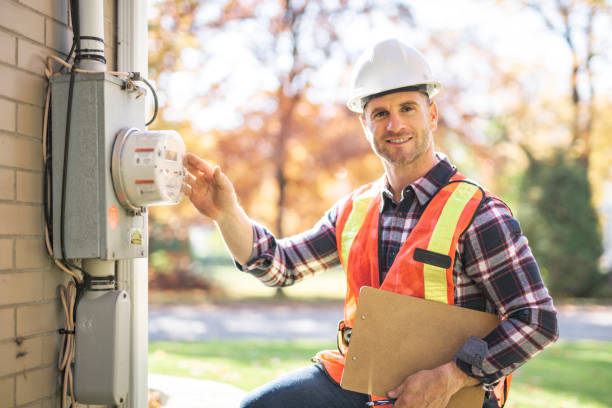 istock man with hard hat standing in front of a electric panel 2185401414