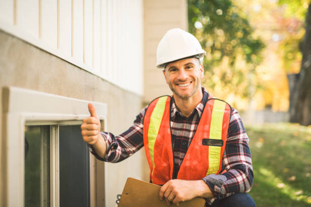 istock Man inspecting house window outside on day light 2185402166