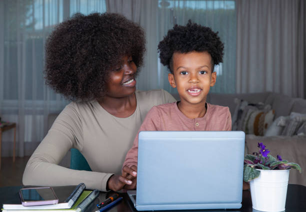 istock Mother working at home with son 2185402263