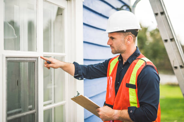istock Man inspecting house window outside on day light 2185402265
