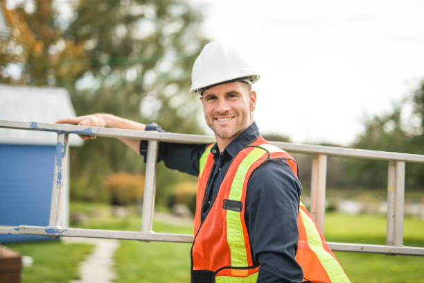 istock inspector or engineer with ladder checking the building structure and house roof specifications. 2185402413