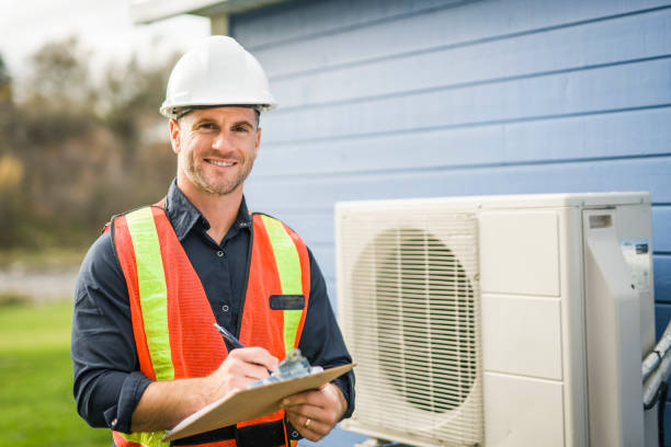 istock technician working on air conditioning or heat pump outdoor unit 2185402458