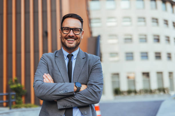 istock Confident Businessman Smiling Outdoors in Urban Setting 2185403580