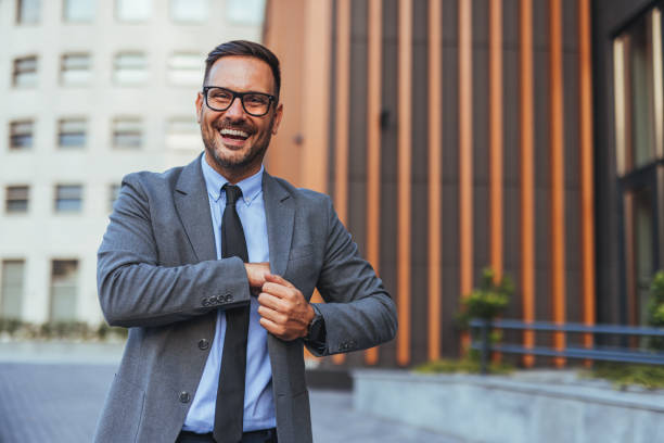 istock Confident Businessman Smiling Outdoors in Urban Setting 2185403585
