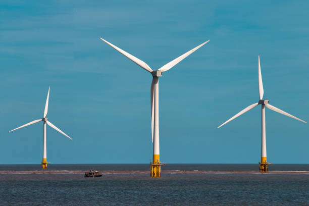 istock Offshore wind turbines farm on the ocean. 2185404339