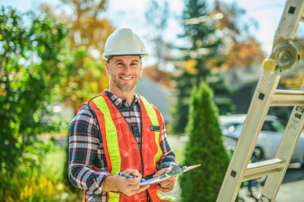 istock inspector or engineer with ladder checking the building structure and house roof specifications. 2185404696