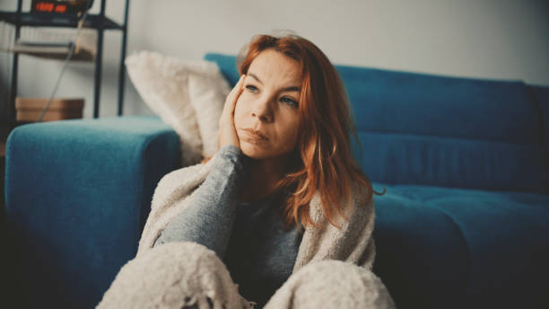 istock Melancholic Mid Adult Woman in Home Setting 2185407004