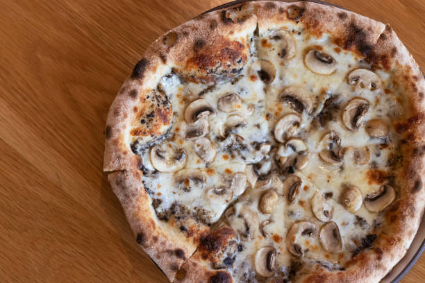 istock Pizza black truffle with cheese melting on plate. 2185407570