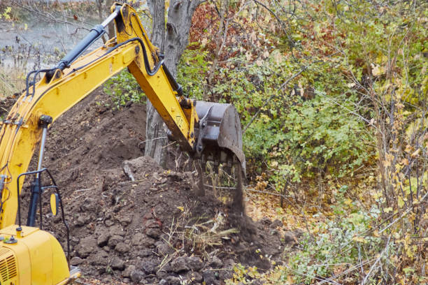istock Close-up of a powerful excavator bucket moving earth. 2185407926