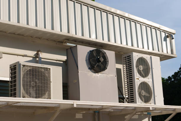 istock Air compressor or air condenser unit located on support outside building to heat released transferred to surrounding environment, Compressor is part of cooling function and air conditioning HVAC syste 2185408760