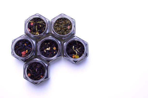 istock Tea leaves on a white background. Jars of tea. 2185408985