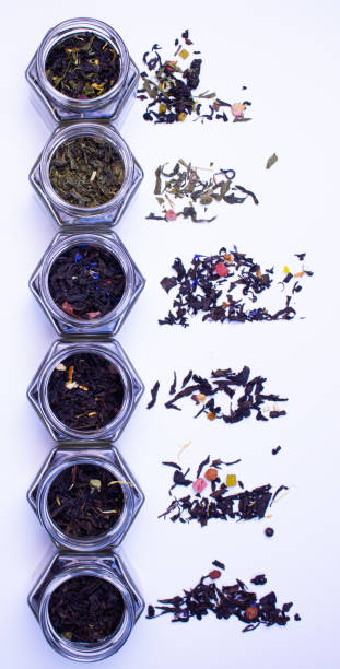 istock Tea leaves on a white background. Jars of tea. 2185409304
