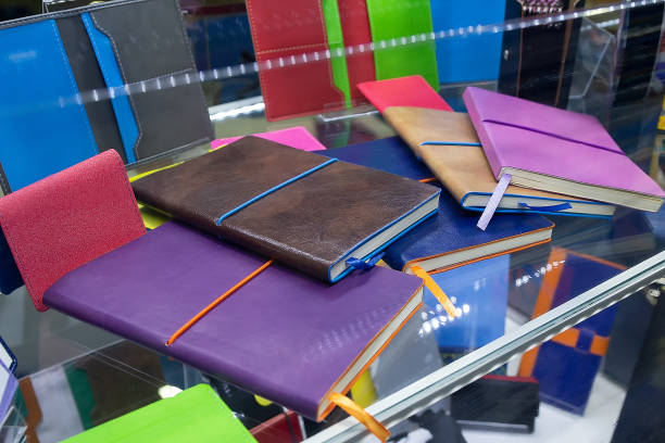 istock Multi-colored notepads on the counter of a stationery store 2185411150