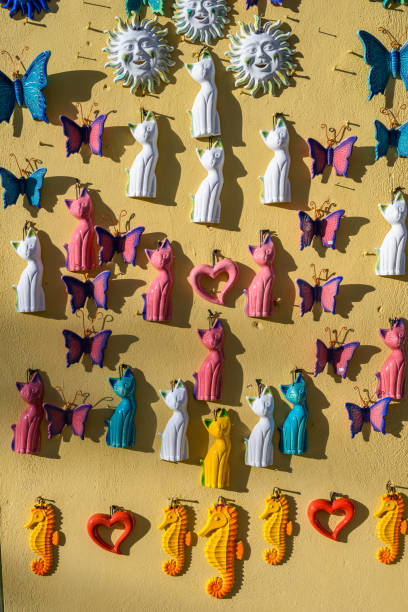 Assortment of ceramic magnets on gift shop wall, Karpathos Town, Karpathos