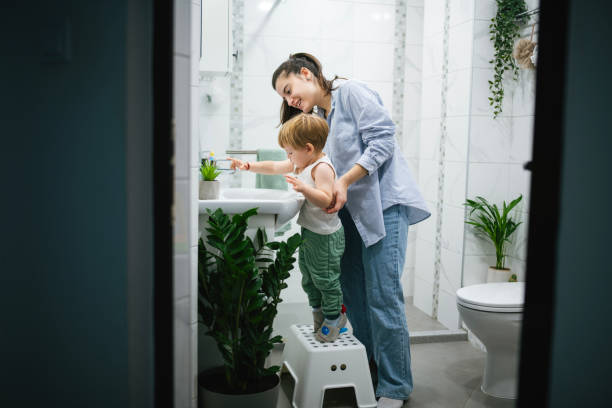 istock Teaching my little boy good hygiene habits. 2185414409