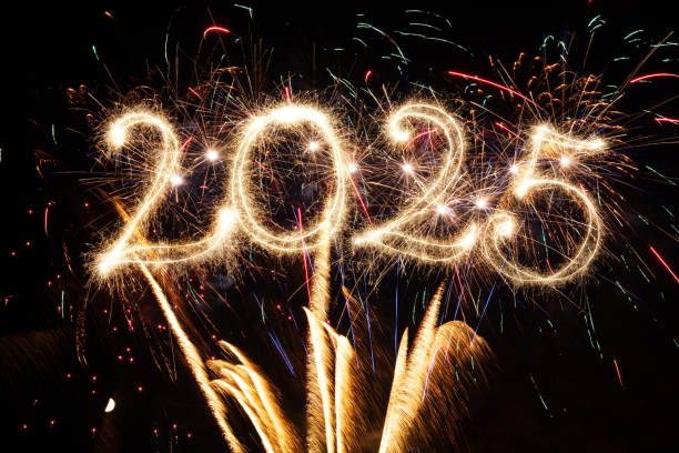 istock Sparkler Happy New Year 2025 with fireworks 2185416122