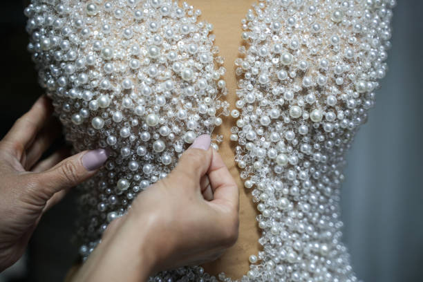With pearl wedding dress is sewing