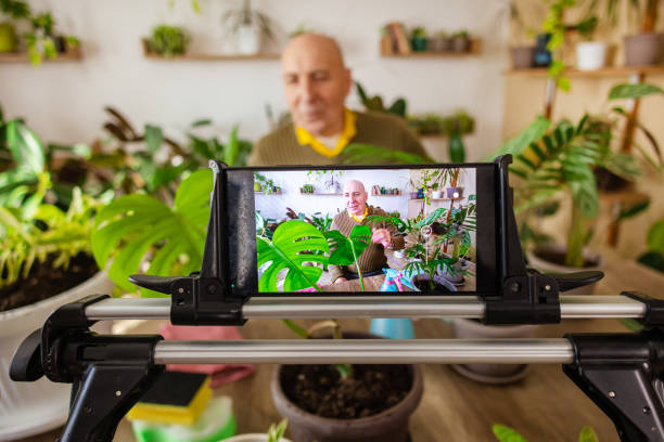 istock Elderly Man Discussing Potted Plants 2185418477