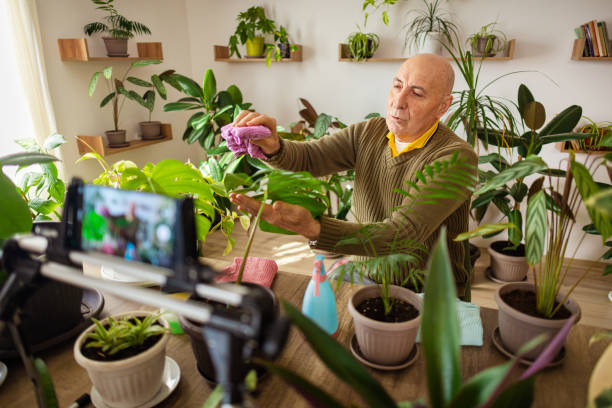 istock Elderly Man Talking About Houseplants 2185418480