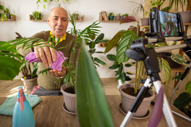 istock Elderly Man Talking About Potted Plants 2185418623