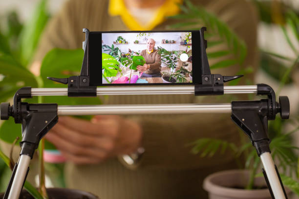 istock Senior Man Teaching Plant Care on Vlog 2185418731